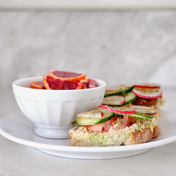 Easy and healthy lunch idea - tuna and avocado tartine sandwich with cucumber, tomato, radish, and dill