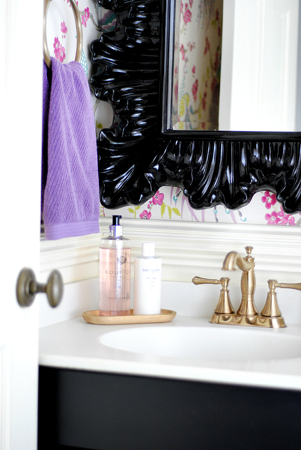 Powder room with Idira Damson peacock wallpaper, black, pink, gold, and purple accents