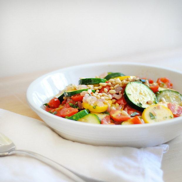 The most delicious, most simple use for all that summer zucchini! A quick sauté and some tomatoes, basil, and pine nuts make this zucchini recipe as irresistible as it is easy.