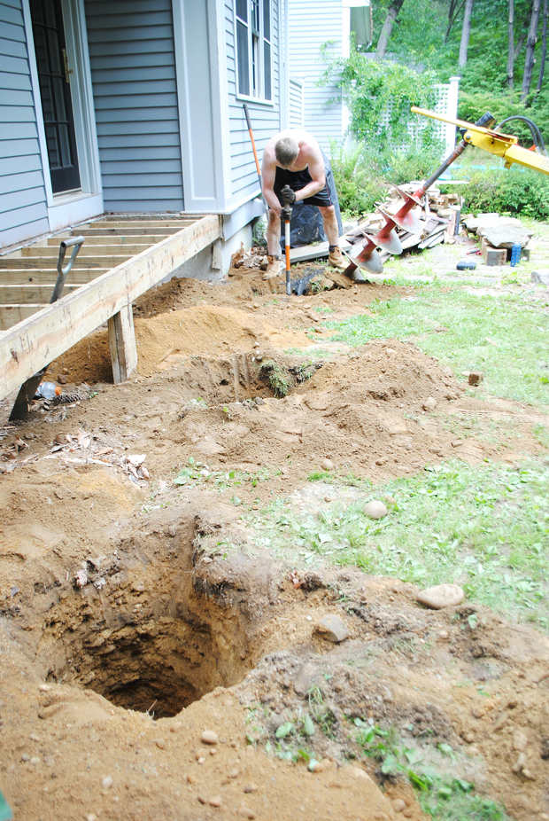 How to build a deck! This post has both video and text tutorials for the first step in building a DIY deck - digging and pouring the concrete footings.