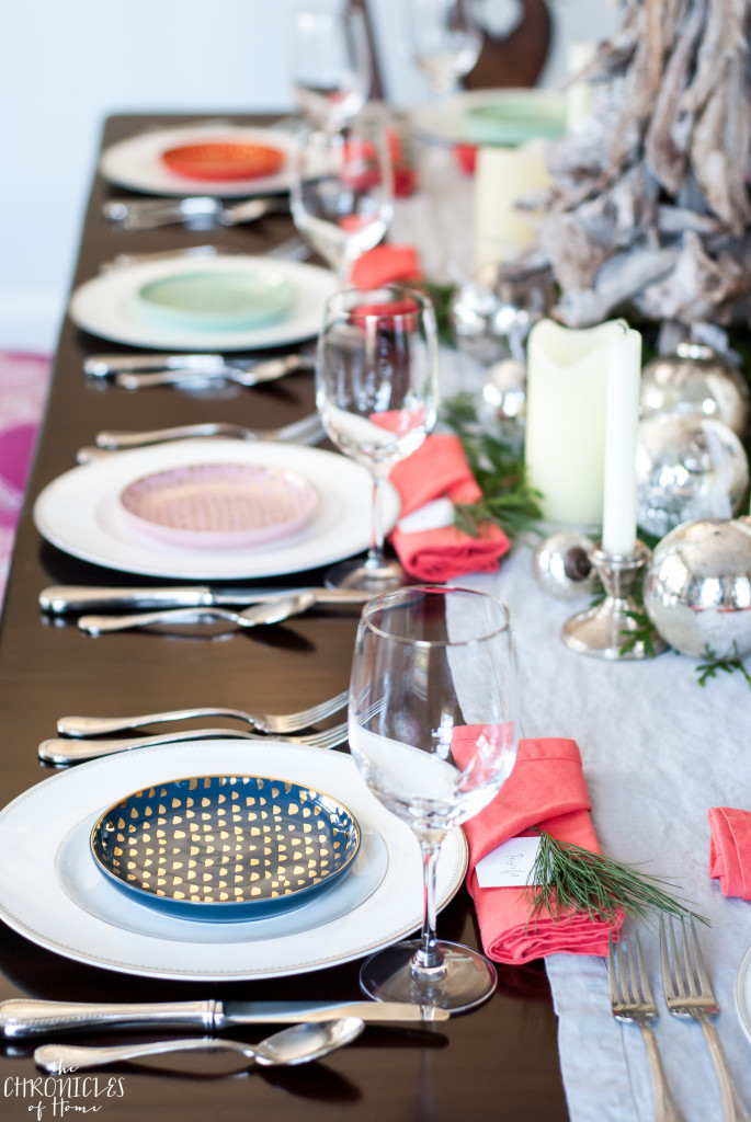 Beautiful Christmas tablescape featuring mercury glass, neutrals, and some pops of coral, navy blue, blush, and mint. Festive and classic but a little unexpected too!