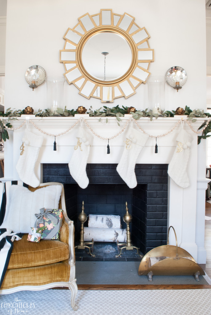 Soft, neutral, glam Christmas mantle with white, gold, greenery, and an easy DIY wood bead garland