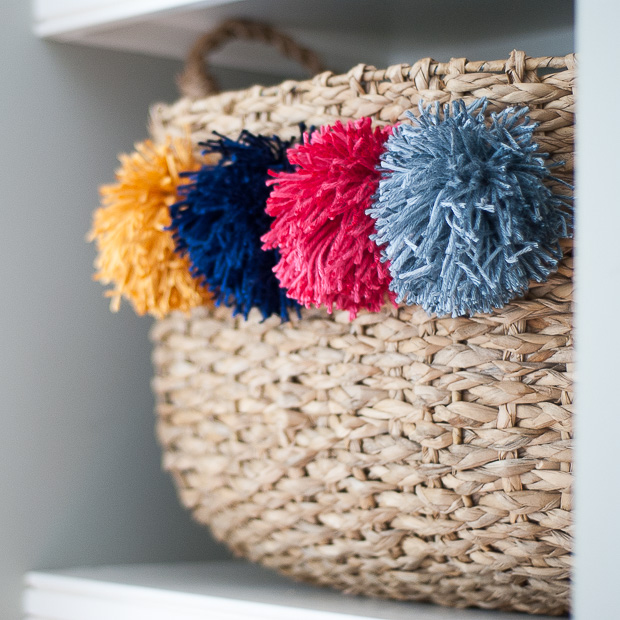 DIY designer-inspired pom pom baskets for a quarter of the cost! Such an easy, chic upgrade to plain baskets.