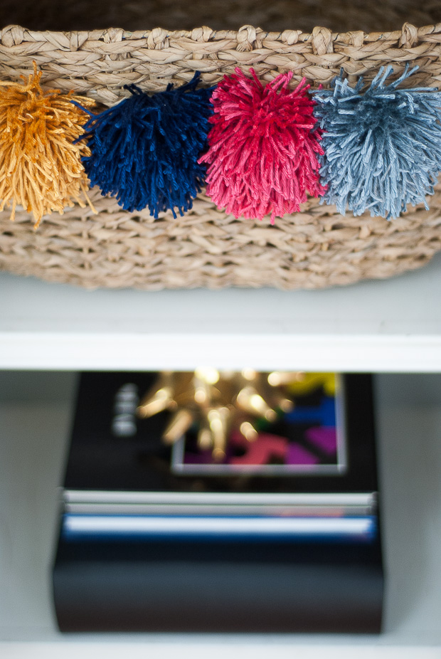 DIY designer-inspired pom pom baskets for a quarter of the cost! Such an easy, chic upgrade to plain baskets.