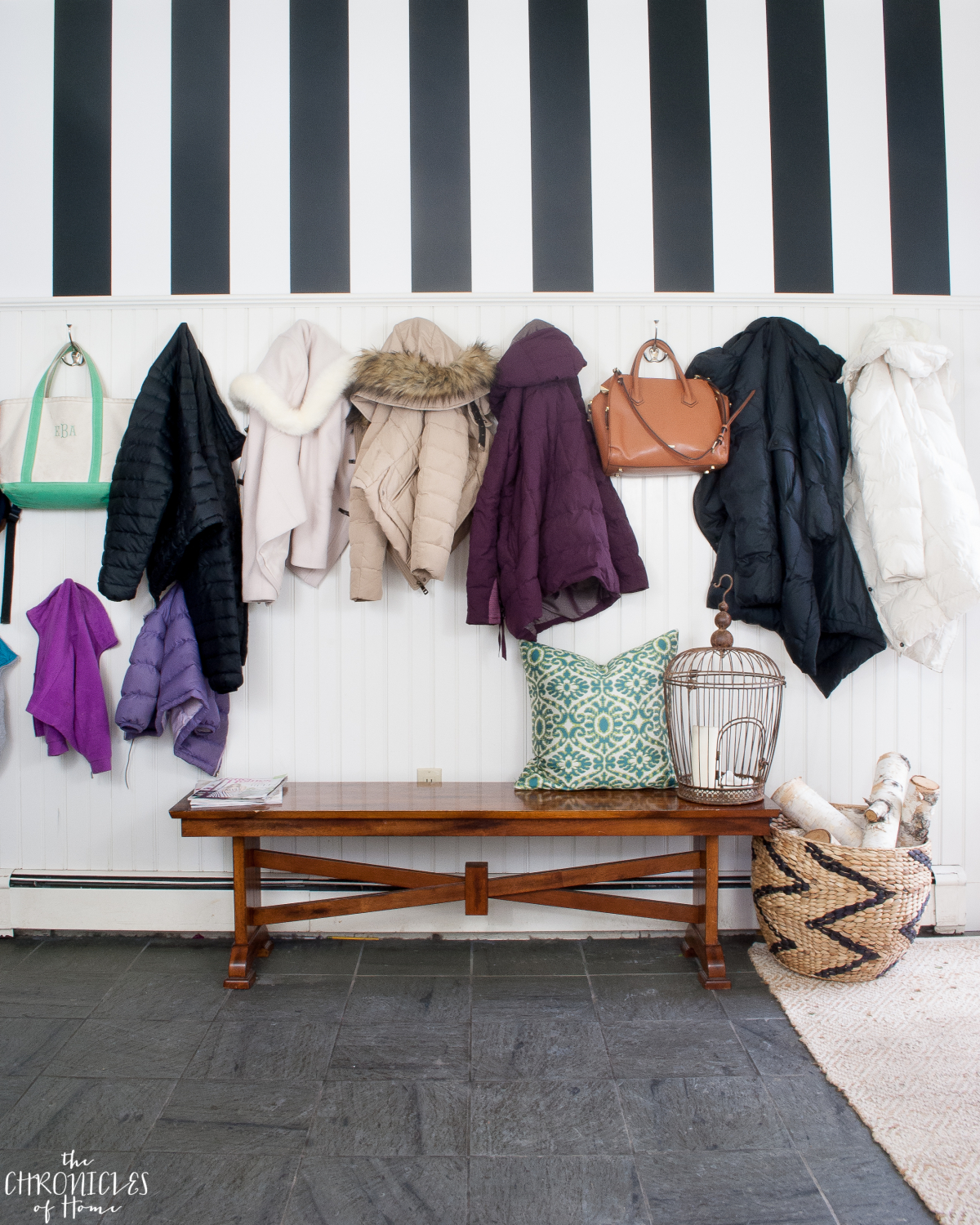 black and white striped wallpaper in a mudroom - classic and bold