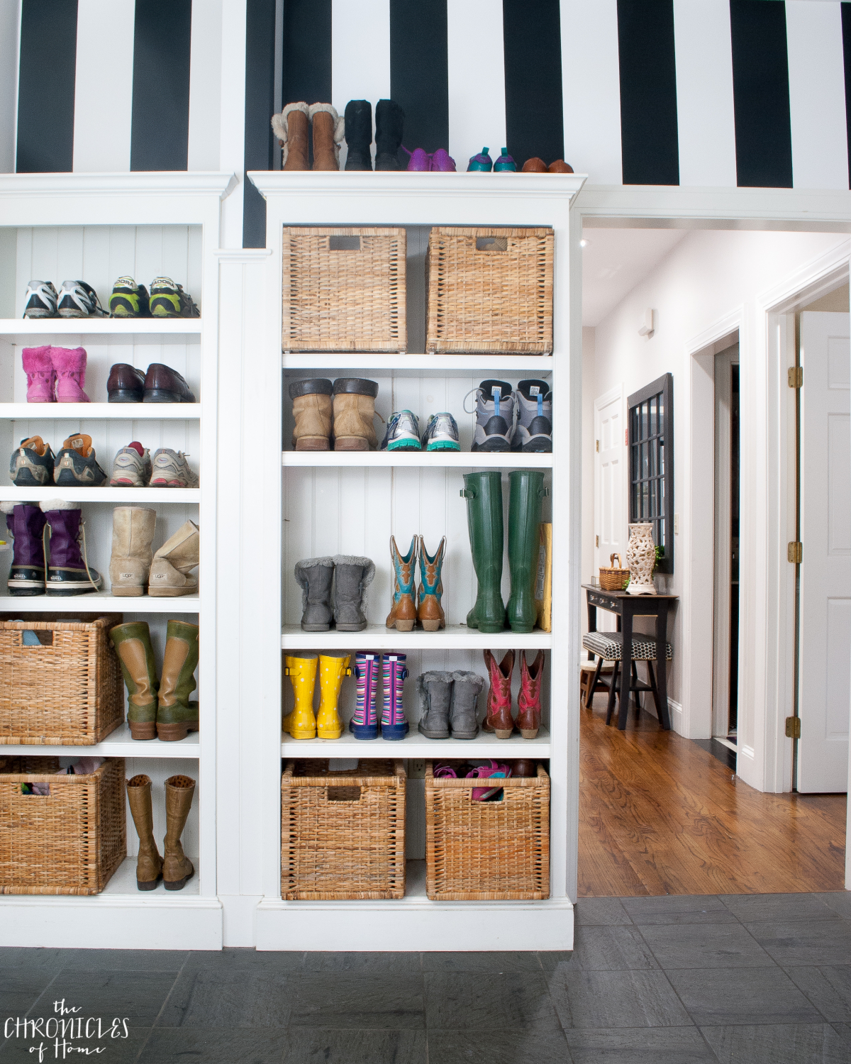 black and white striped wallpaper in a mudroom - classic and bold