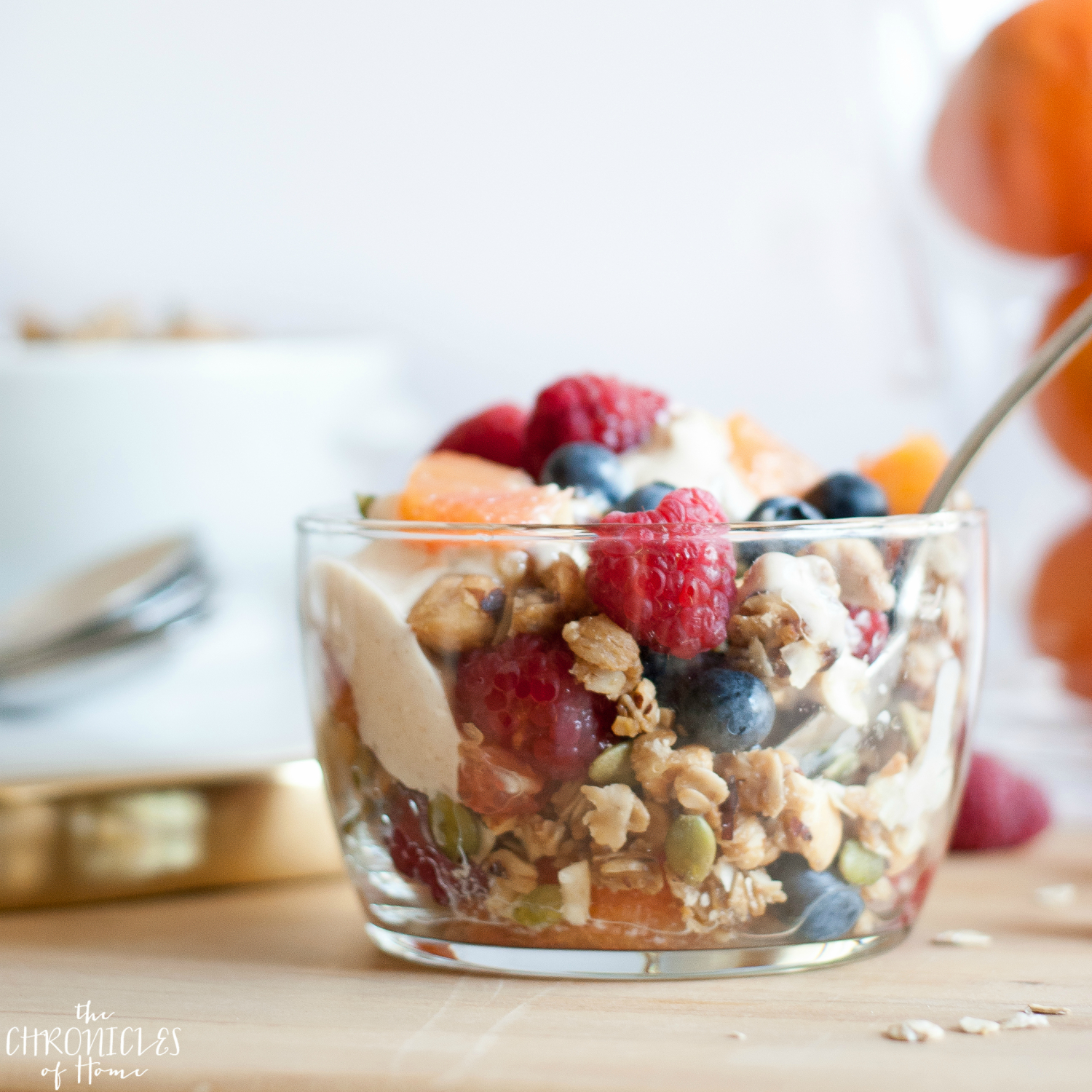 Oat and nut breakfast crumble - healthy, hearty, and delicious with nuts, seeds, fresh fruit, and an easy homemade cinnamon yogurt drizzle