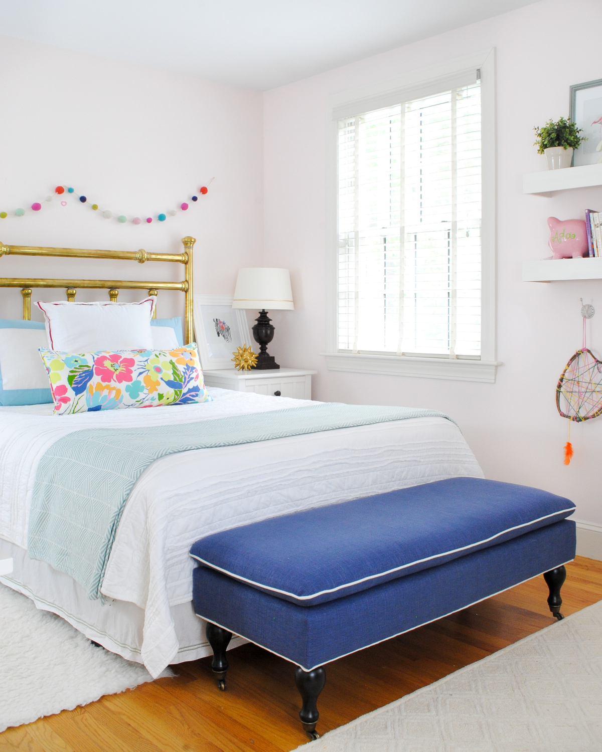 Beautiful neutral girl bedroom with navy blue, aqua, and pink accents - a bedroom to grow with a little girl.