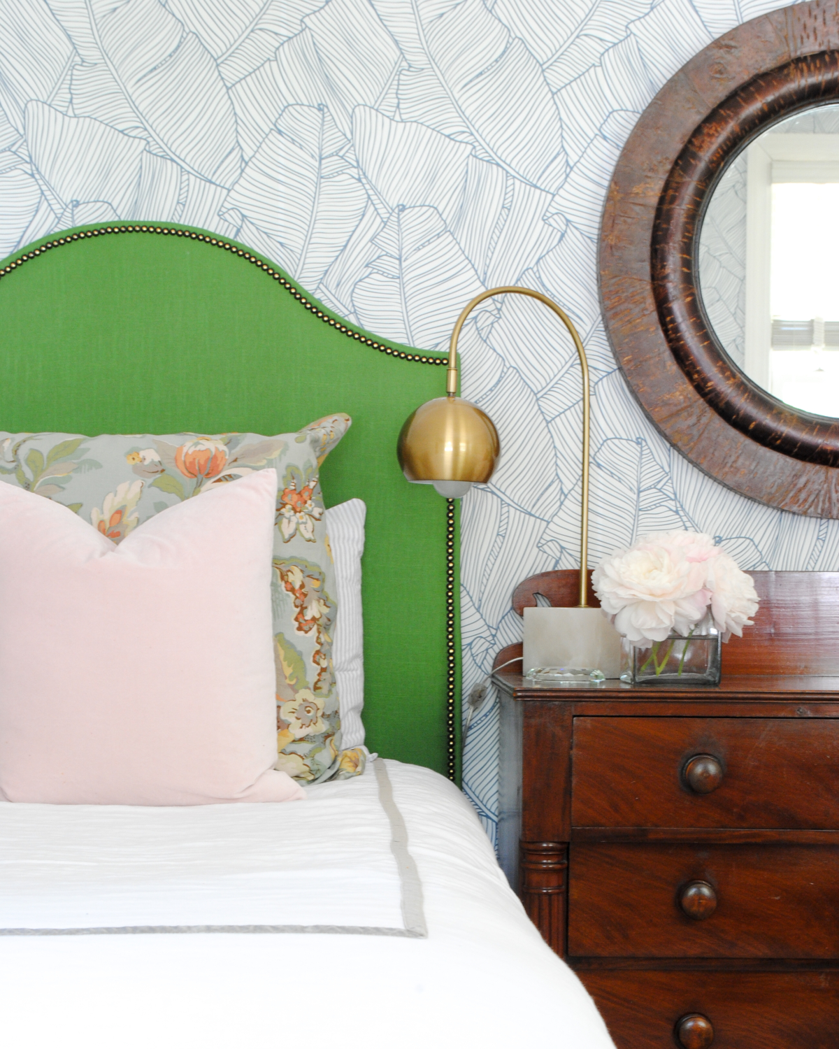 DIY kelly green upholstered headboard - get a full tutorial on how you can make this gorgeous linen headboard with brass nailheads YOURSELF!!