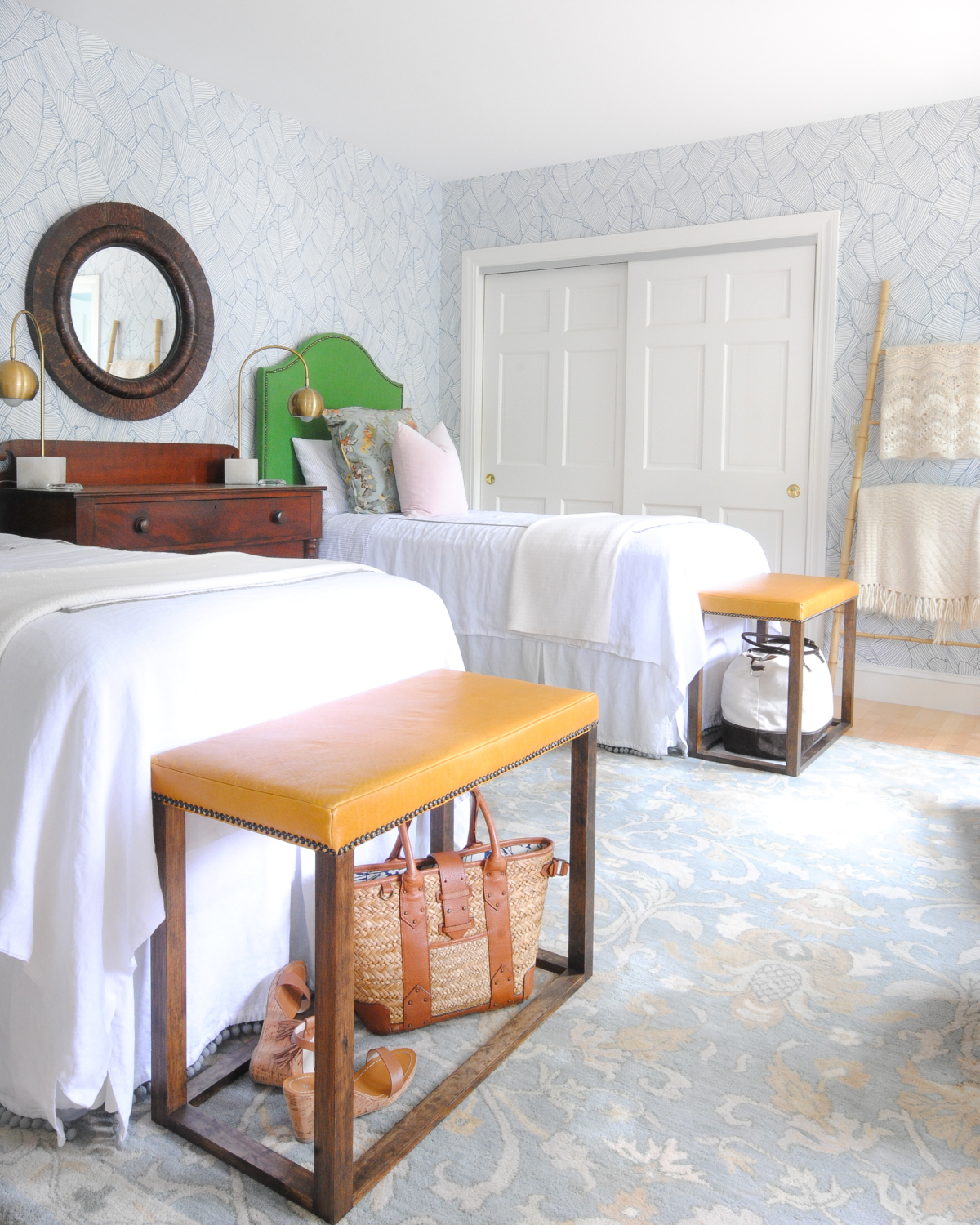 Beautiful bedroom with blue and white wallpaper, kelly green DIY upholstered headboards, blush pink, DIY leather bed benches. Such a stylish, happy, and serene space!