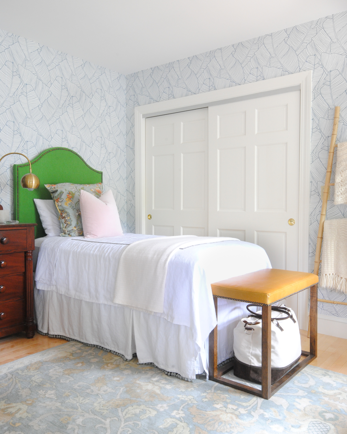 Beautiful bedroom with blue and white wallpaper, kelly green DIY upholstered headboards, blush pink, DIY leather bed benches. Such a stylish, happy, and serene space!