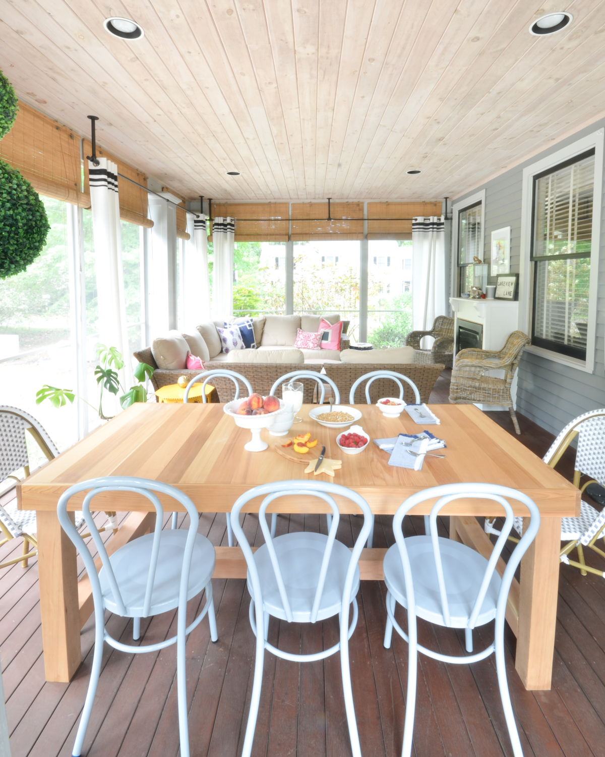 Metal bentwood chairs (that come in nine different colors!) and a DIY outdoor dining table inspired by a $4000 Restoration Hardware table are the perfect finishing touches to this totally gorgeous screened porch!