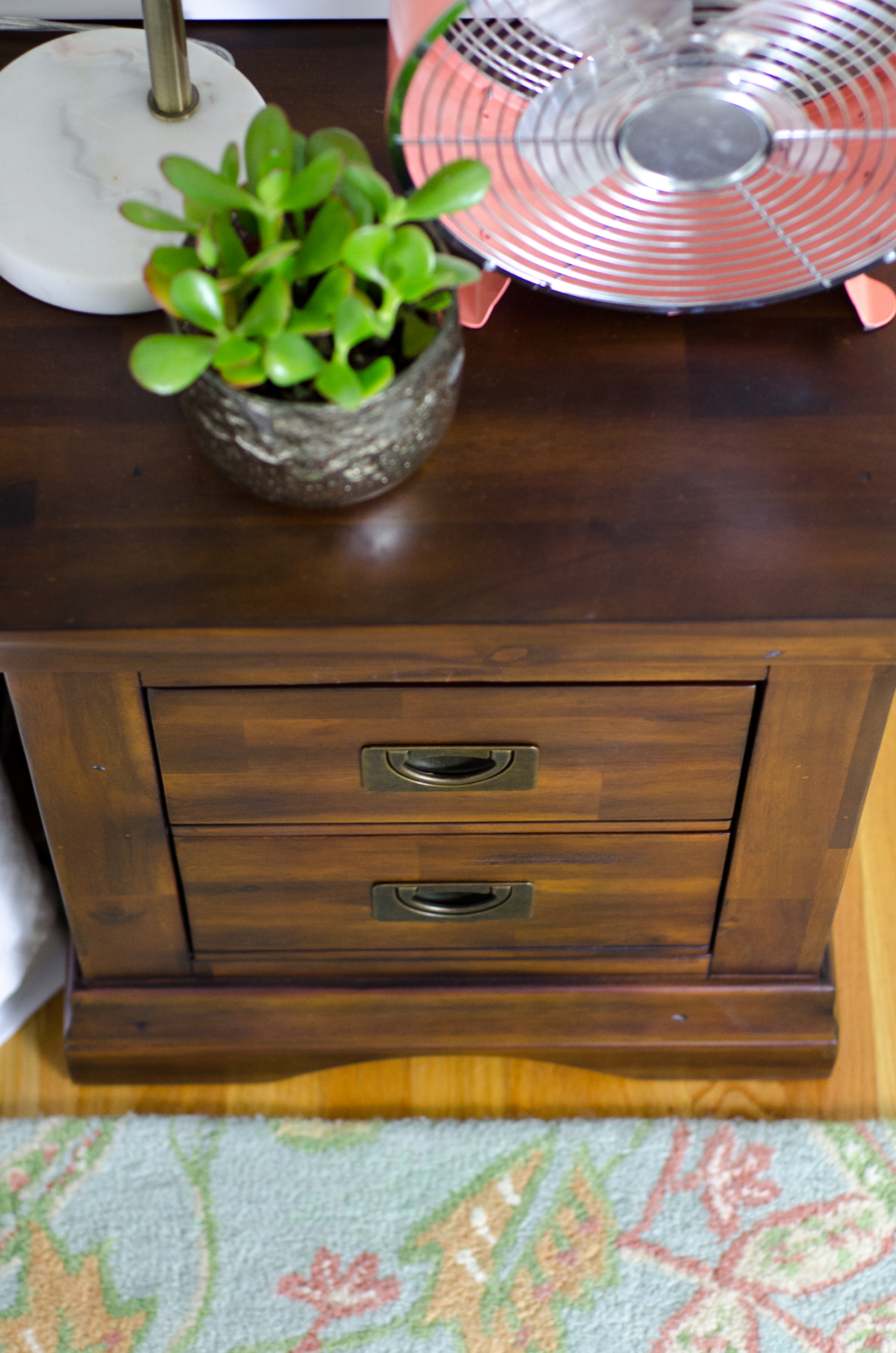 Hardwood dresser with campaign pulls (SUPER affordable) in a darling girl's bedroom