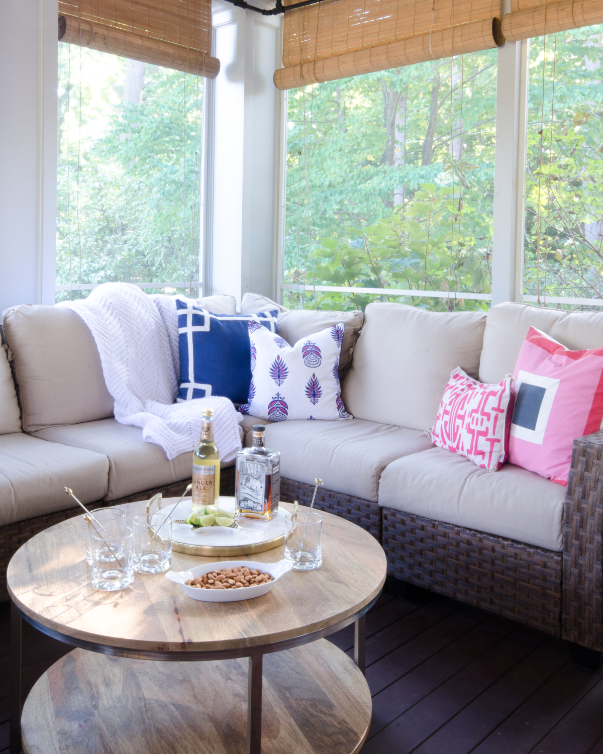 Stunning classic screened porch with pink, navy blue, and white.