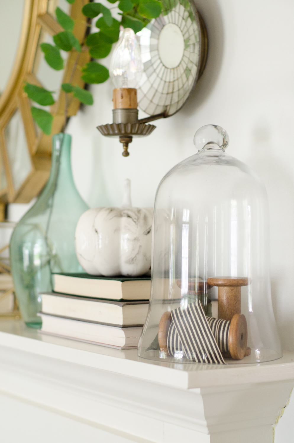 Classic layered fall mantle with green, gold, white, and teal