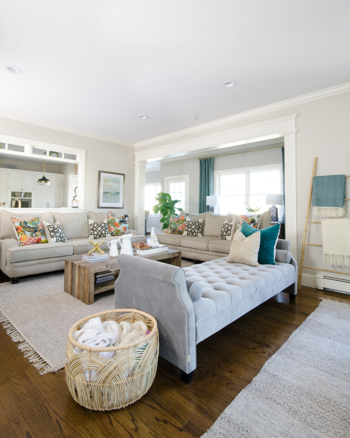 Stylish family room with neutral base, pops of color, and reclaimed wood that is both chic and family friendly