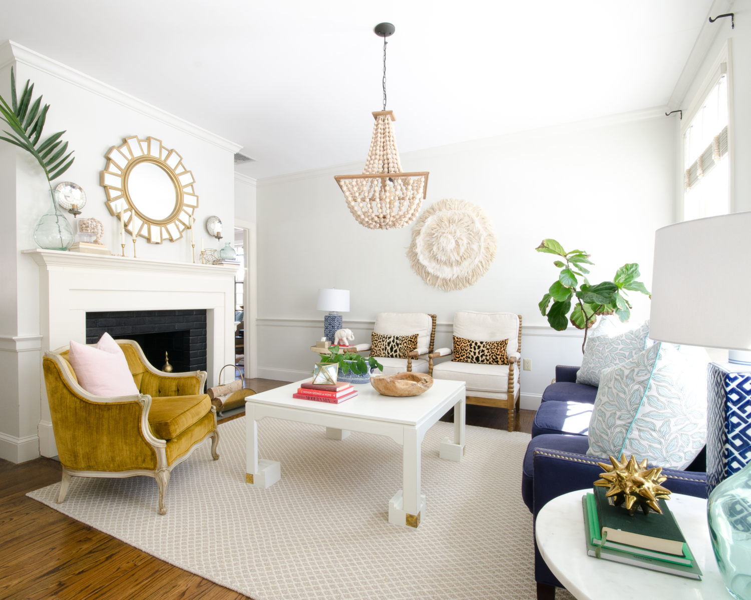 Spring decorating ideas in a classic living room with neutral base pieces and a variety of blue accents.