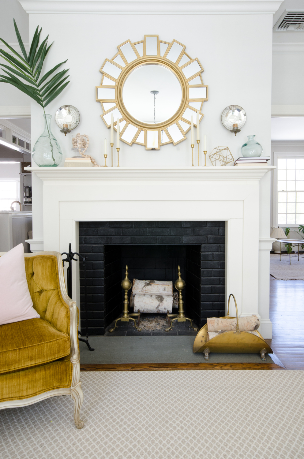 Spring mantle idea - aqua recycled glass vases, vintage brass tulip candlesticks, and a handmade wooden bead strand.