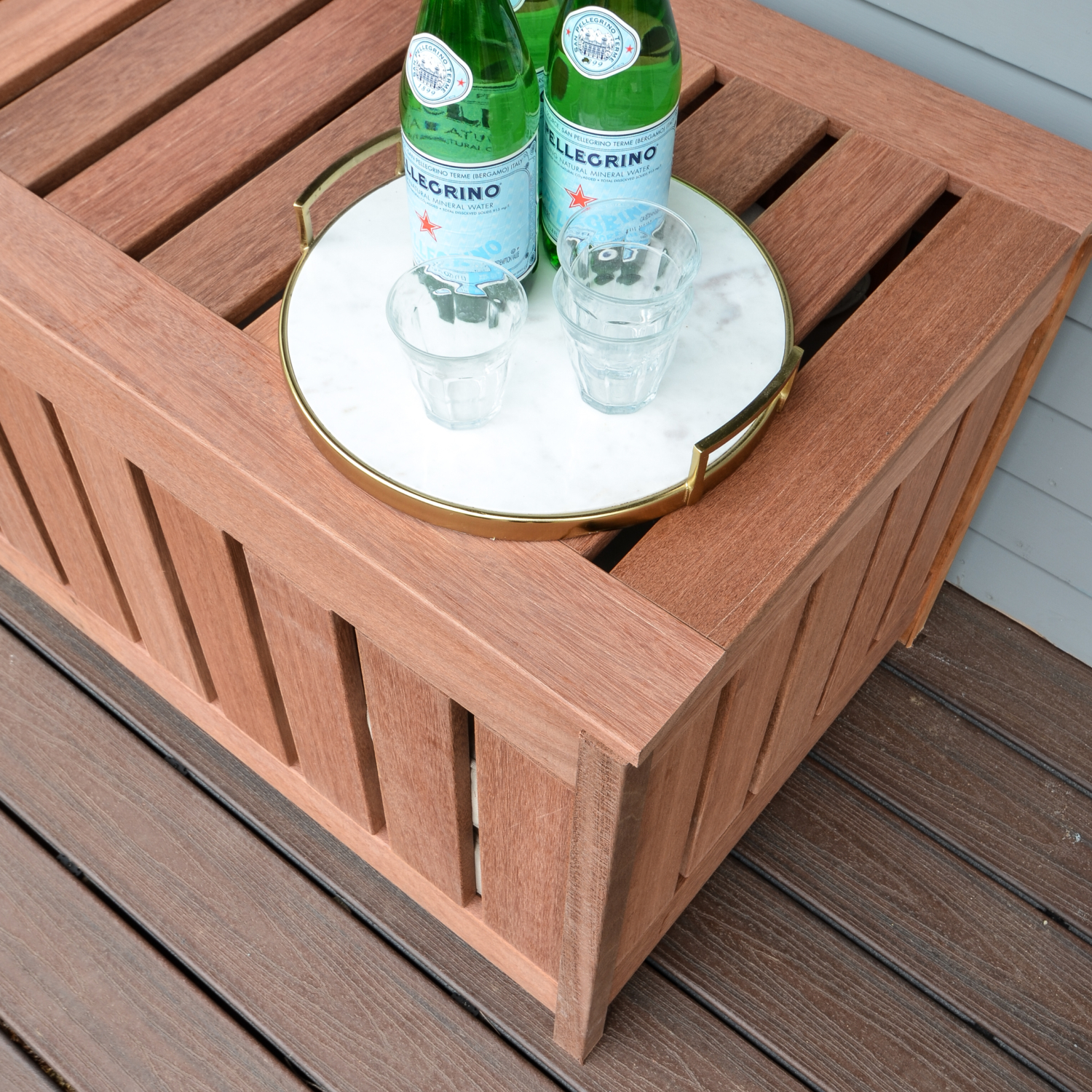 FREE plans for making a DIY outdoor storage box for outdoor cushions! Plus, it doubles as an outdoor bench seat and serving surface.