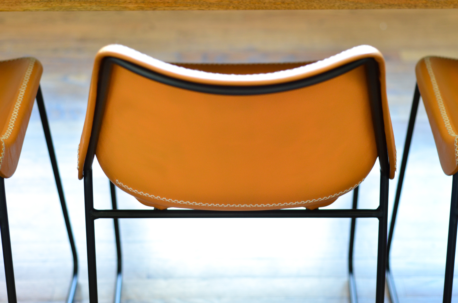 Leather side chairs in a breakfast nook makeover in process. Stylish, kid-friendly dining chairs can be hard to find but these small-scale beauties fit the bill!