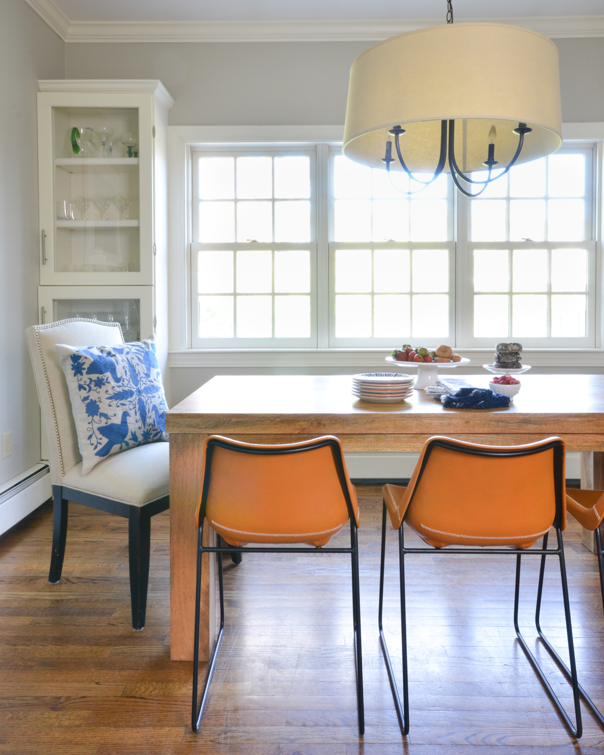 Leather side chairs in a breakfast nook makeover in process. Stylish, kid-friendly dining chairs can be hard to find but these small-scale beauties fit the bill!