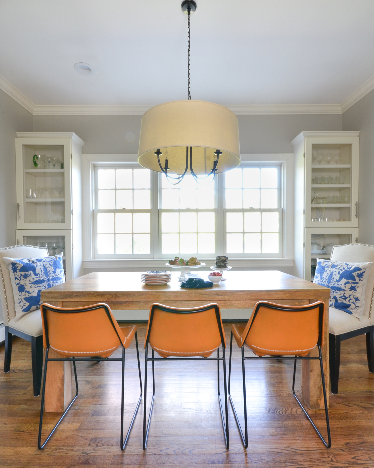 Leather side chairs in a breakfast nook makeover in process. Stylish, kid-friendly dining chairs can be hard to find but these small-scale beauties fit the bill!