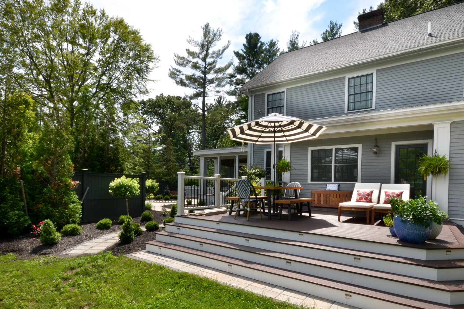 Stunning deck and patio featuring Trex Lava Rock and Techo Bloc pavers