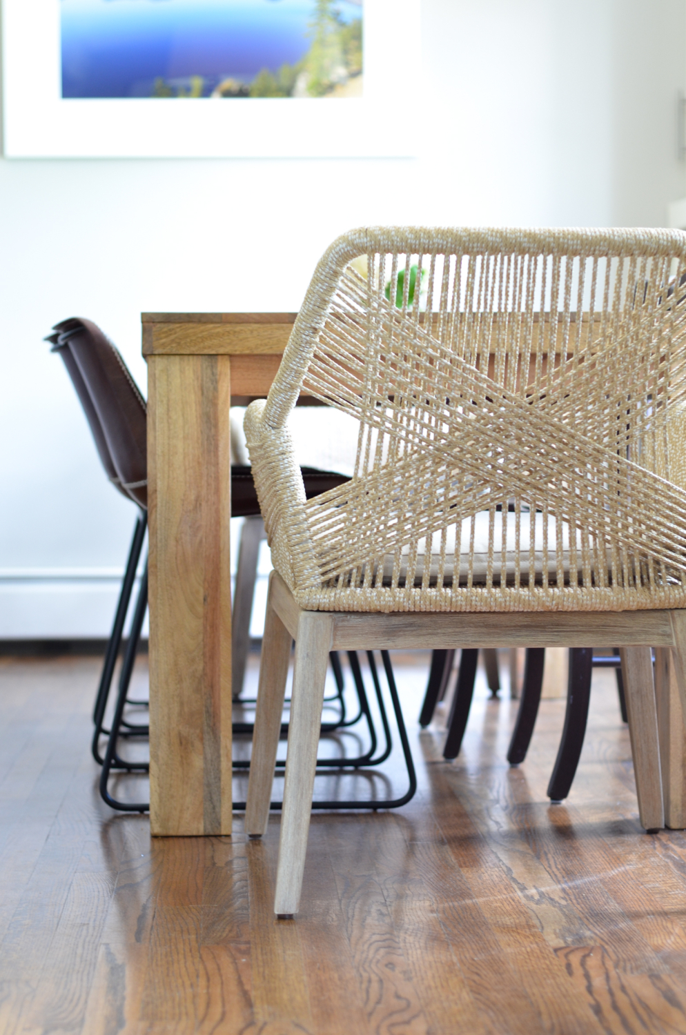 Beige rope chairs are a stunning addition to this chic yet family friendly breakfast nook makeover.