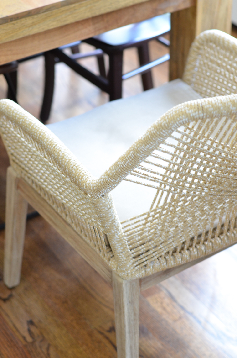 Beige rope chairs are a stunning addition to this chic yet family friendly breakfast nook makeover.
