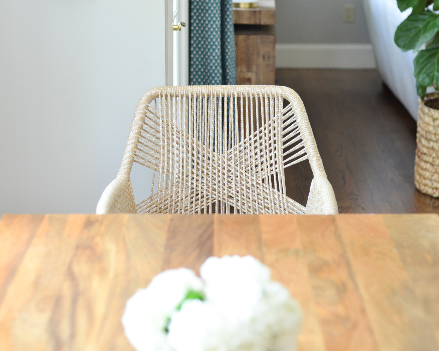 Beige rope chairs are a stunning addition to this chic yet family friendly breakfast nook makeover.