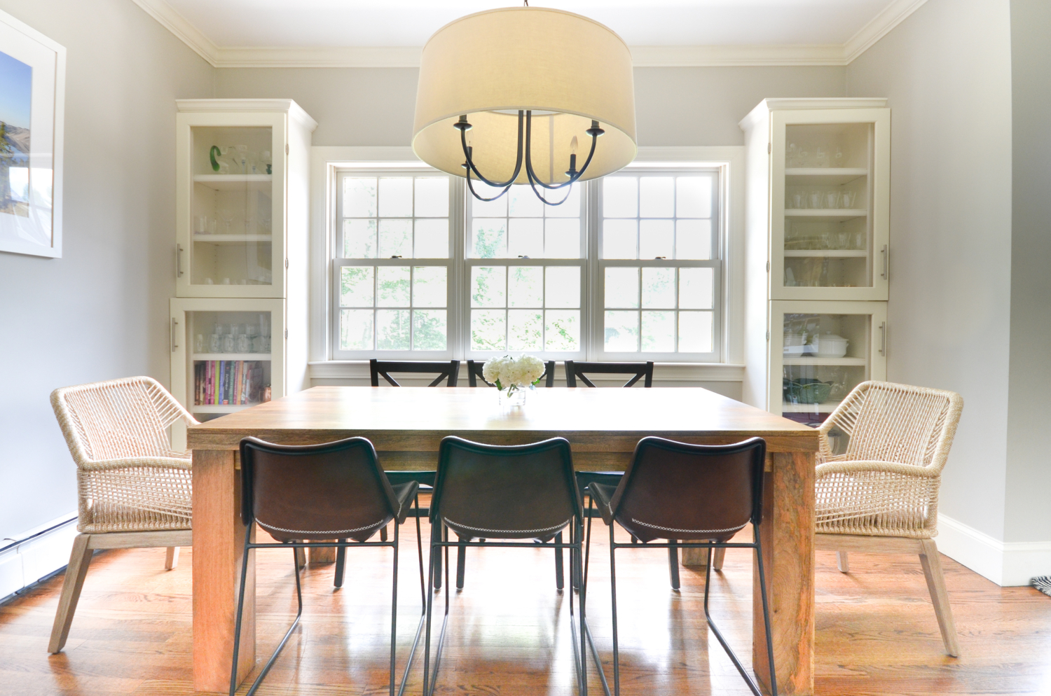 Beige rope chairs are a stunning addition to this chic yet family friendly breakfast nook makeover.