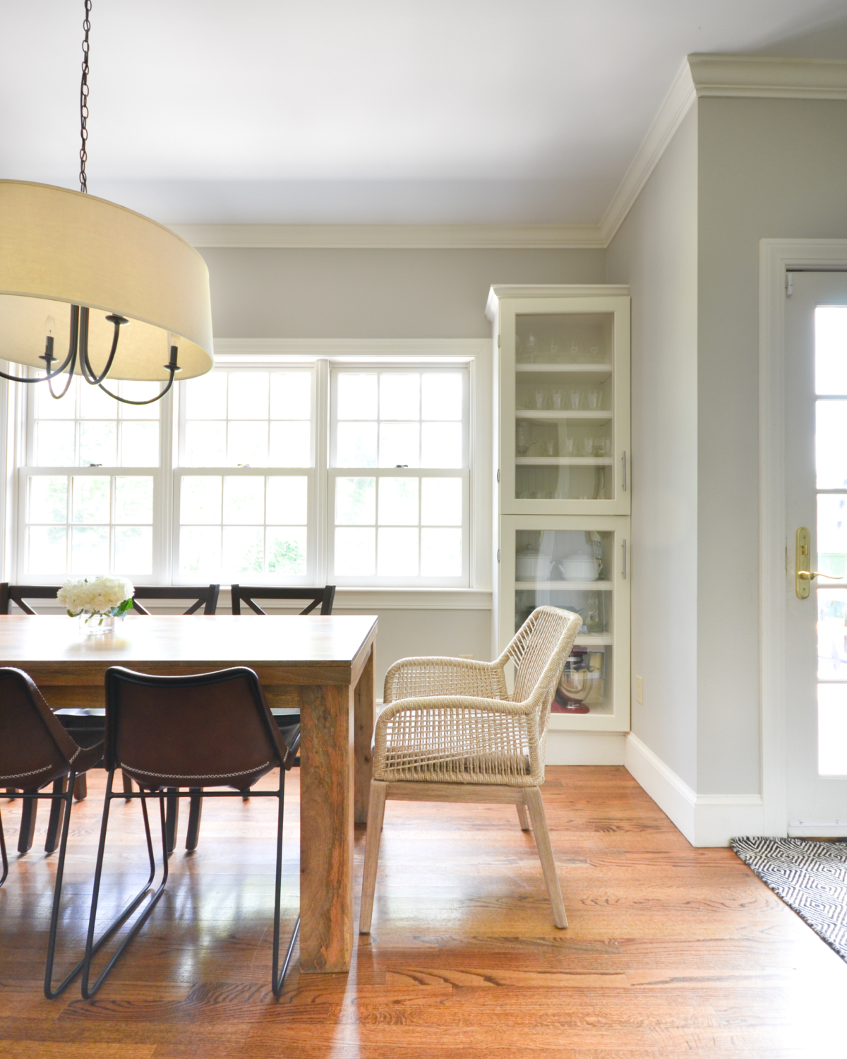 Beige rope chairs are a stunning addition to this chic yet family friendly breakfast nook makeover.