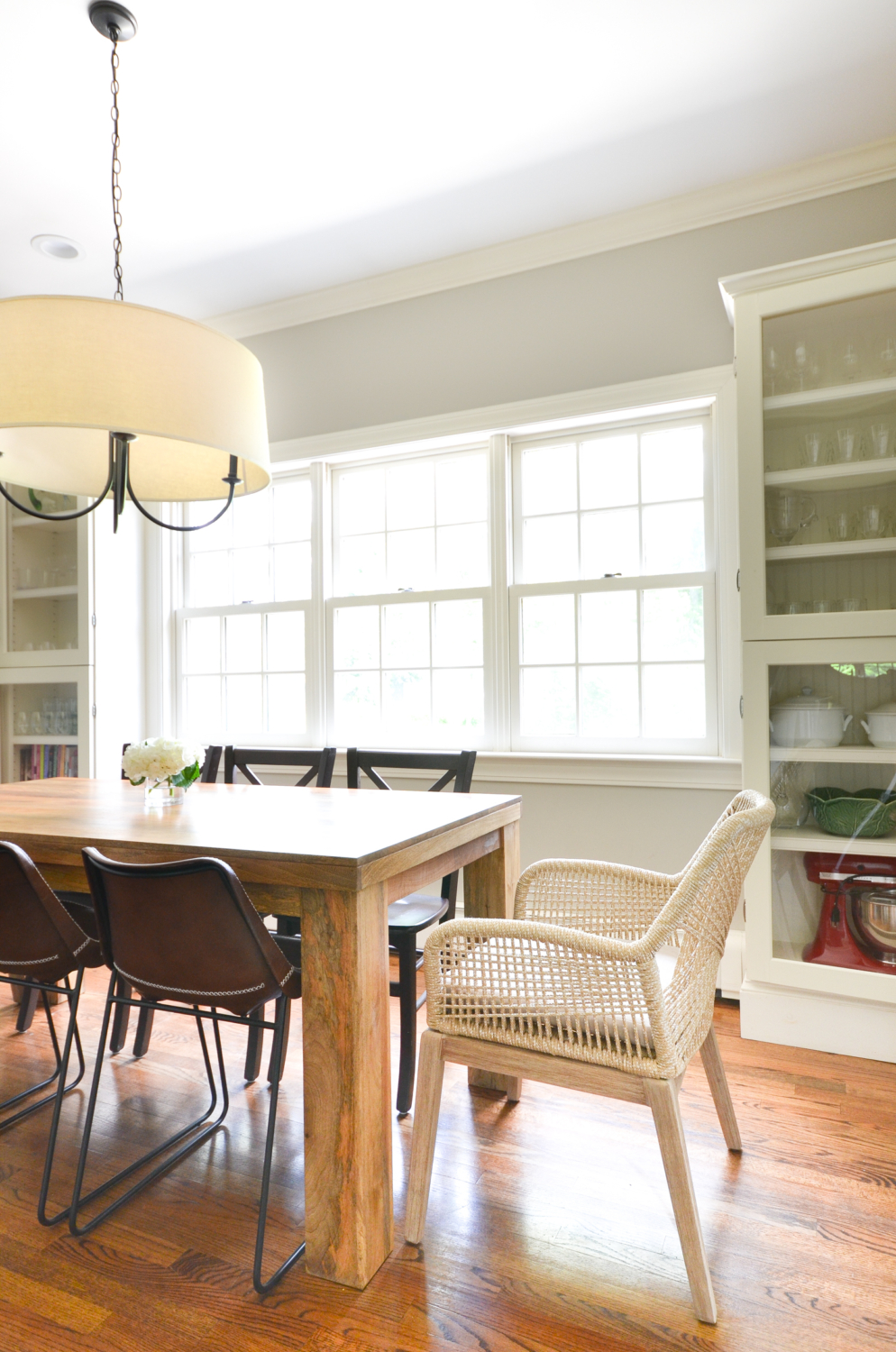 Beige rope chairs are a stunning addition to this chic yet family friendly breakfast nook makeover.