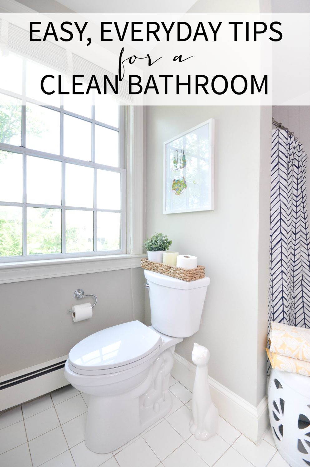 Easy tips for a clean bathroom that you can use everyday, plus sources for this pretty, simple white and navy bathroom