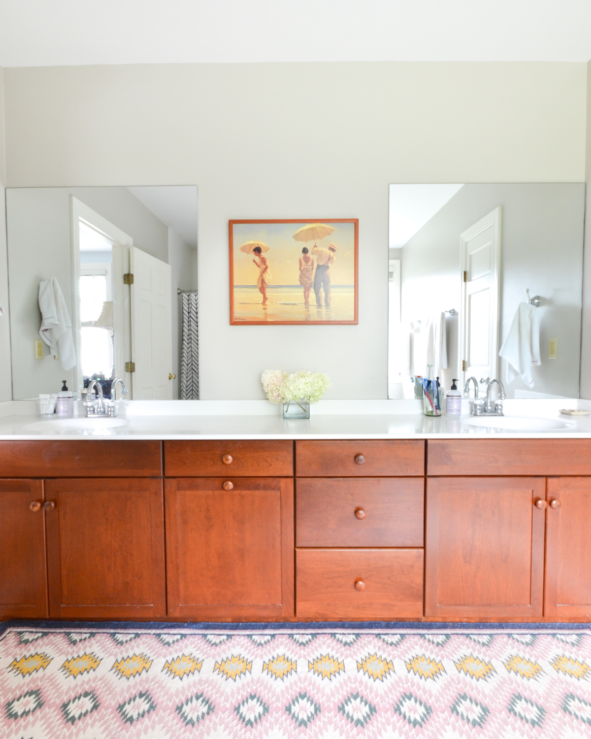 Easy tips for a clean bathroom that you can use everyday, plus sources for this pretty, simple white and navy bathroom