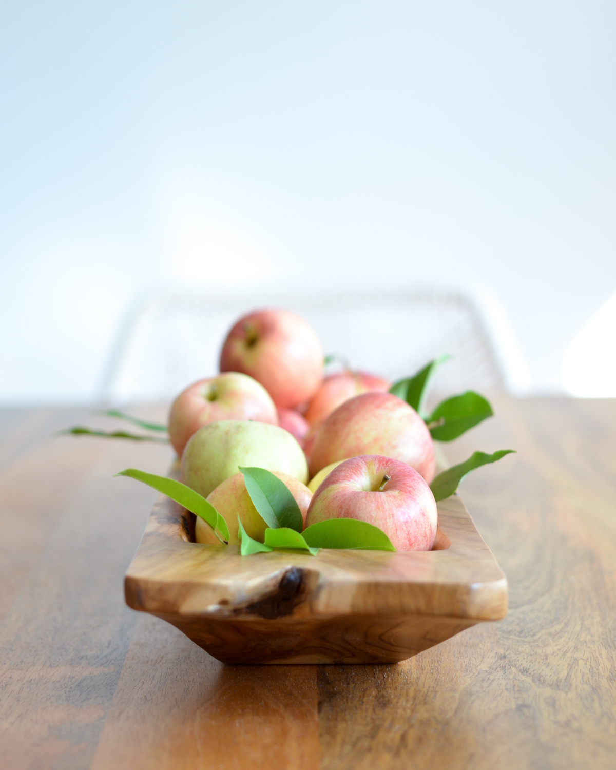 Simple fall decorating with a dough bowl, apples, and leaves clipped from the yard