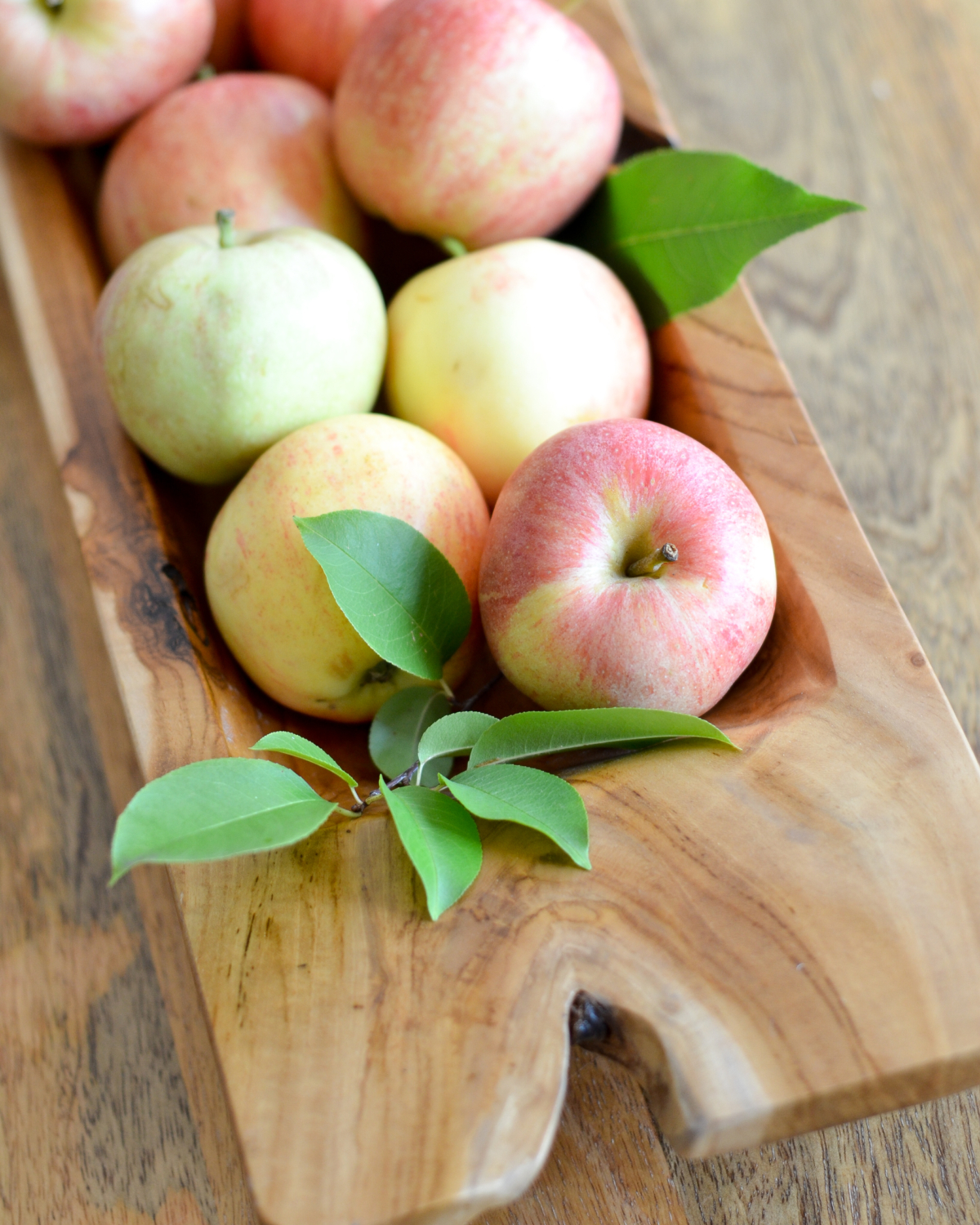 Simple fall decorating with a dough bowl, apples, and leaves clipped from the yard.