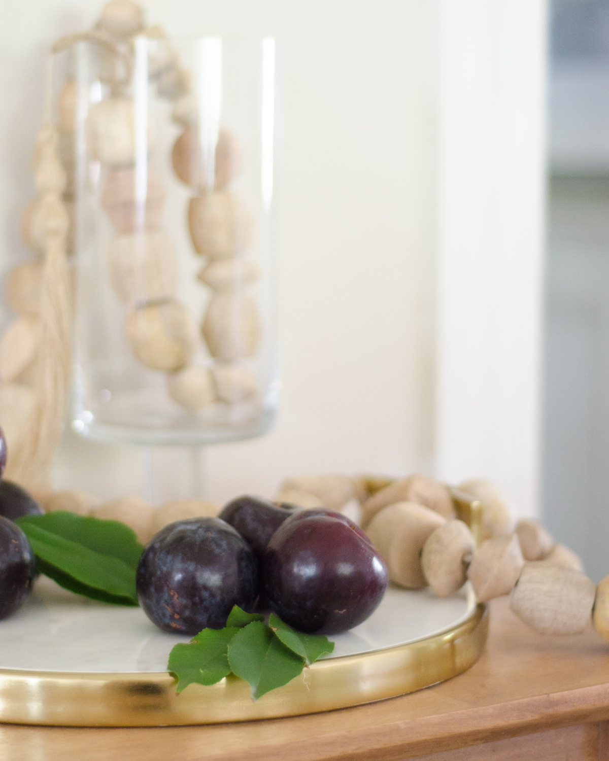 Simple fall decorating with fruit and a wood bead garland