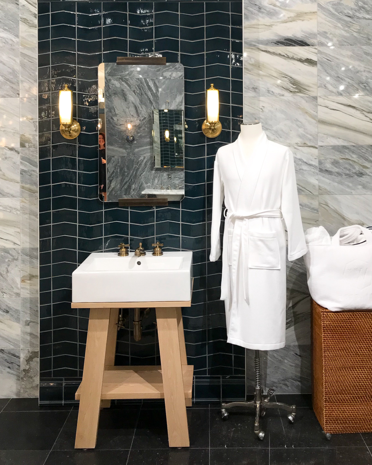 Bathroom ideas - marble, navy blue tile, brass sconces