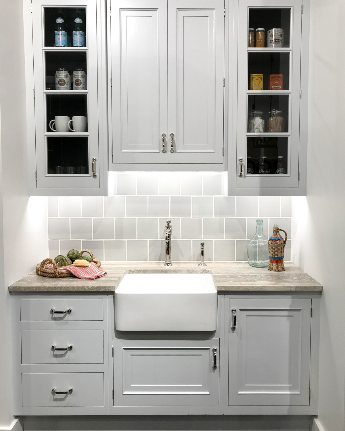 Pantry with grey cabinets, farmhouse sink, polished chrome hardware