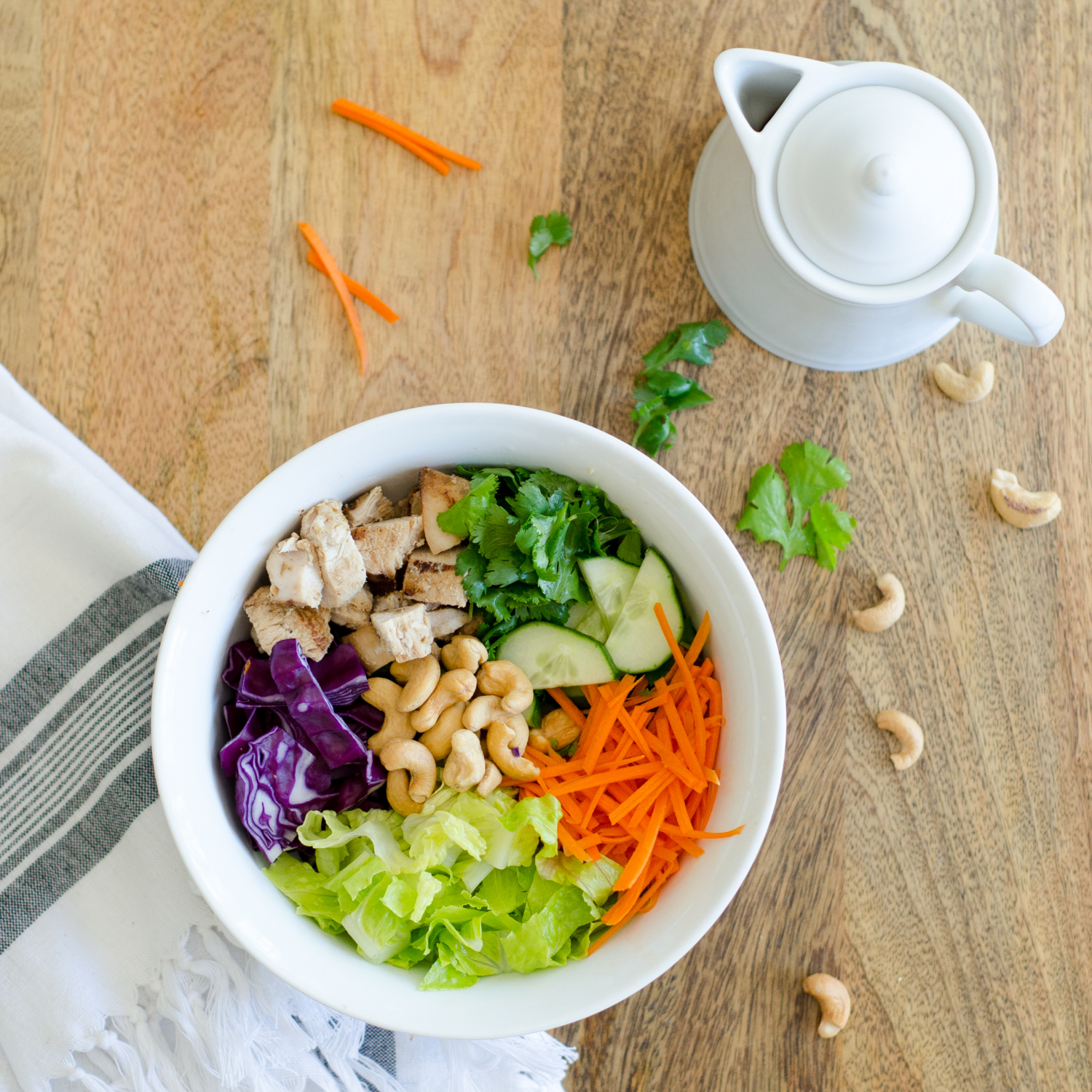 Thai chicken bowls - like thai lettuce wraps in a bowl! Loaded with veggies and topped with a nutty, creamy dressing. Paleo and Whole 30 recipe.