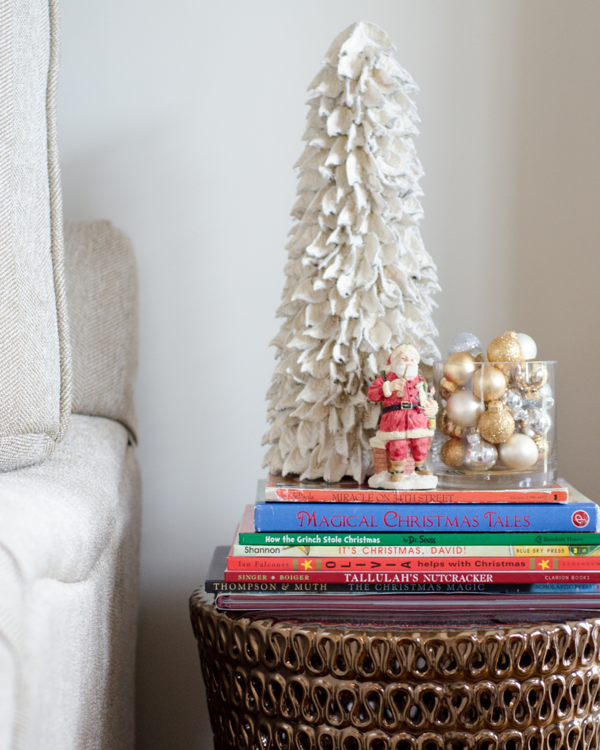 A simple and classic Christmas family room with greenery, white, and gold accents. 2017 Holiday Housewalk