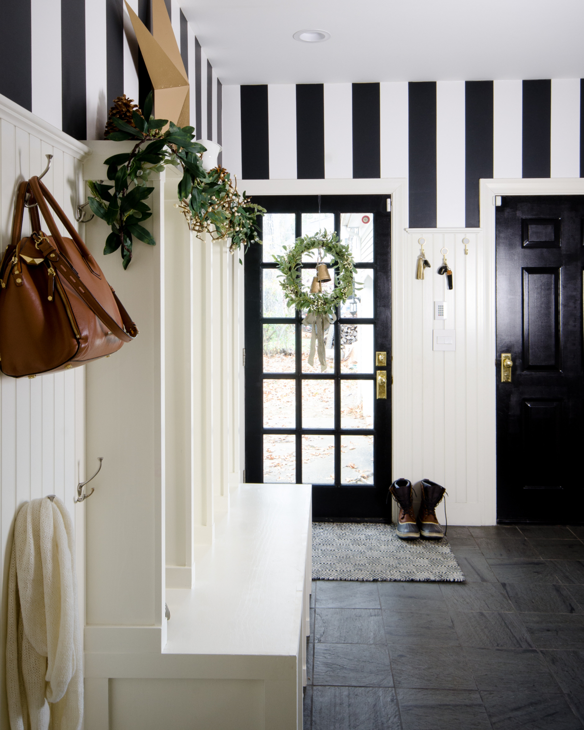 Simple and classic Christmas decorating for the mudroom - black, white, and green. 2017 Holiday Housewalk