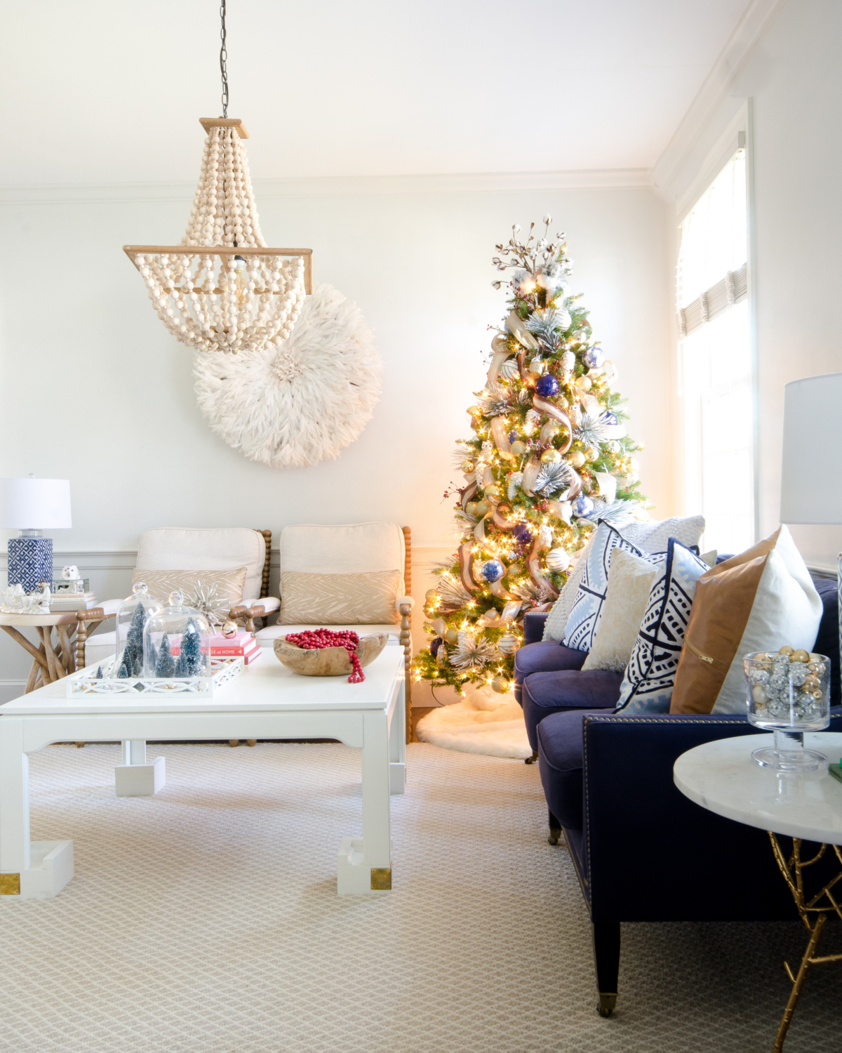 Magical Christmas living room with whites, neutrals, and blues.