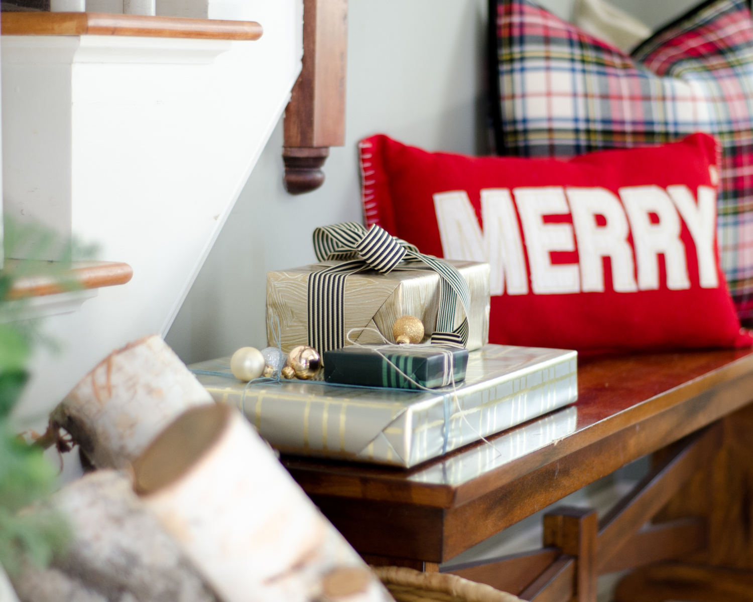 Classic Christmas entry with red, black, white, and greenery
