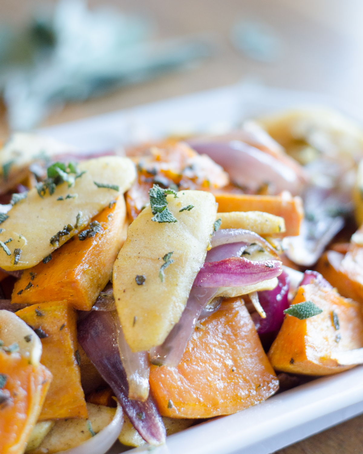 Recipe for roasted sweet potatoes and apples. An easy and delicious fall or winter side dish. Would be an excellent easy Thanksgiving side dish too!