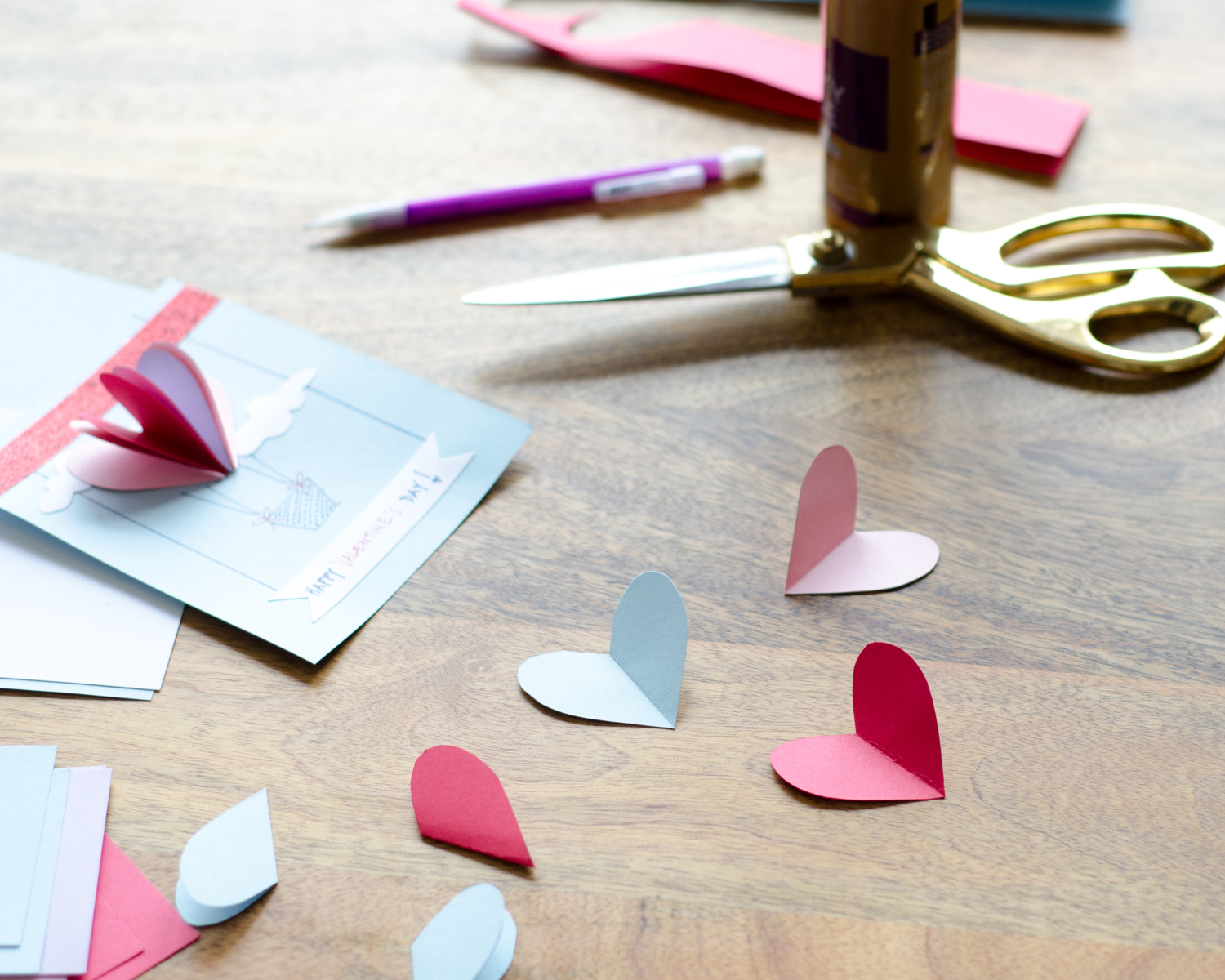 Easy DIY Valentines with 3D paper hearts. Great Valentine's craft for kids that can also be used for exchanging cards at school!