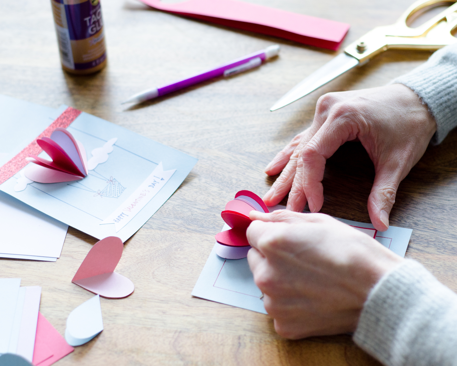 Easy DIY Valentines with 3D paper hearts. Great Valentine's craft for kids that can also be used for exchanging cards at school!