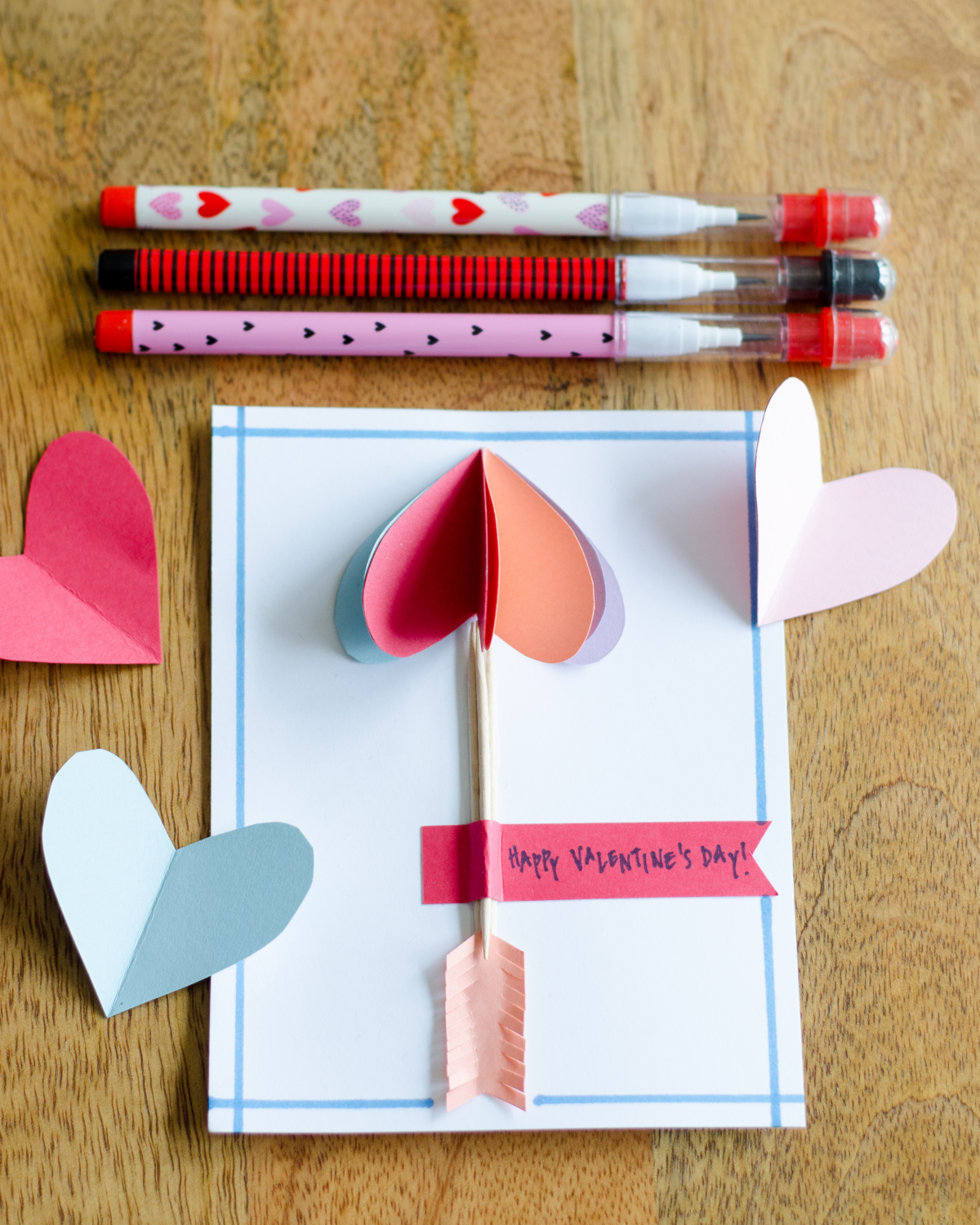 Easy DIY Valentines with 3D paper hearts. Great Valentine's craft for kids that can also be used for exchanging cards at school!