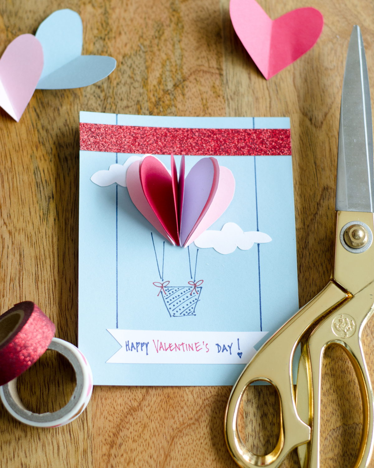 Easy DIY Valentines with 3D paper hearts. Great Valentine's craft for kids that can also be used for exchanging cards at school!